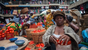 Matilda Moses sells tomatoes in Tudu Market, part of a sprawling district of open-air and covered markets in Accra, Ghana. Photo: Yepoka Yeebo